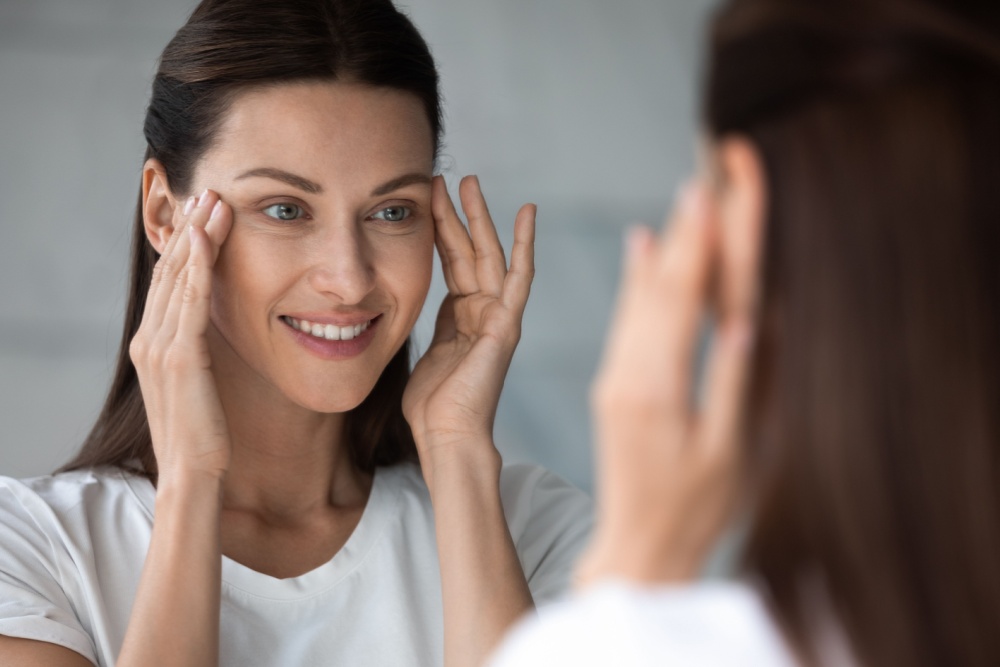 Woman touching head happy
